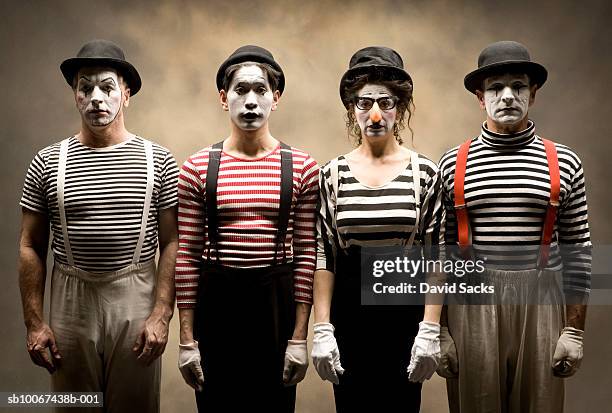 portrait of four mimes standing in row - mime stock pictures, royalty-free photos & images