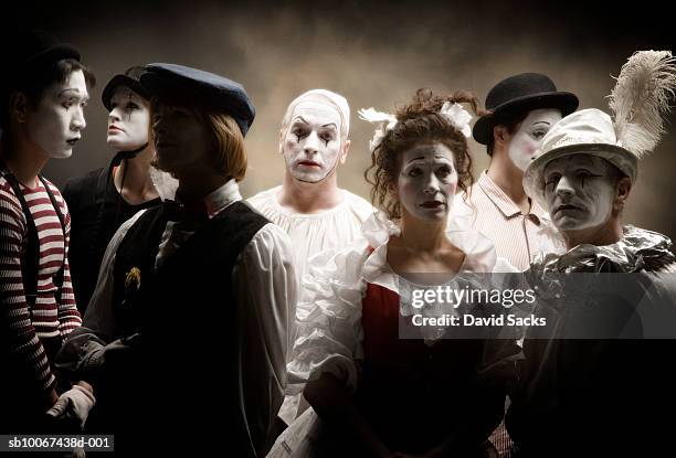 group of mimes in stage costumes - circus lights stock pictures, royalty-free photos & images