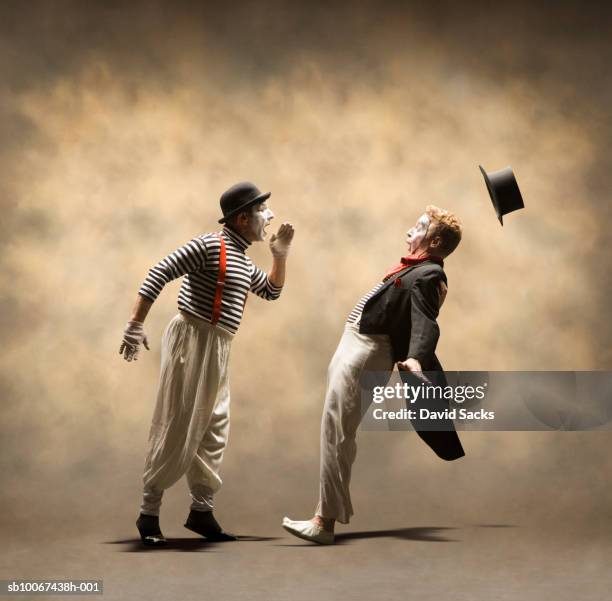 one mime yelling at another - mime stock pictures, royalty-free photos & images