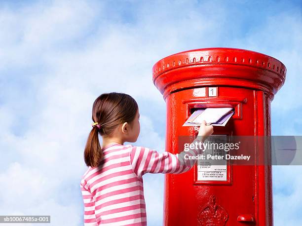 girl (6-7) posting letter - letter box stock pictures, royalty-free photos & images