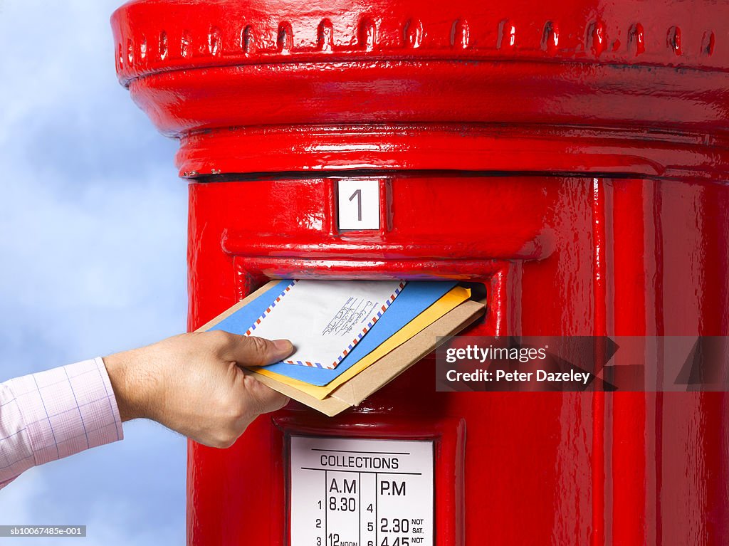 Man posting letter
