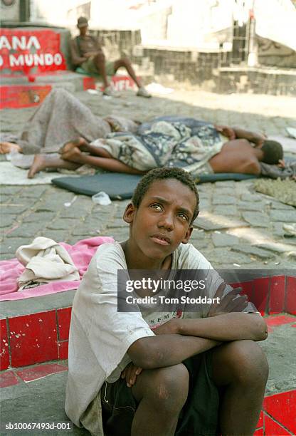 Street kids pictured asleep under a viaduct in the Lapa district of downtown Rio De Janeiro. In the foreground is Phillipe who has run away from home...