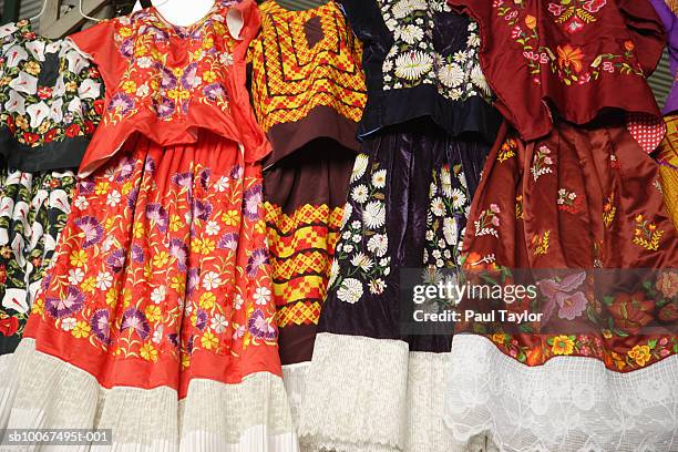 embroidery dress at market, low angle view - mexican embroidery stock pictures, royalty-free photos & images