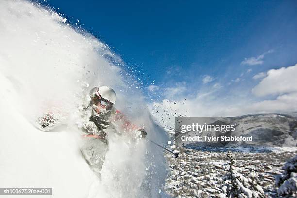 skier making steep powder turn - snowmass stock pictures, royalty-free photos & images