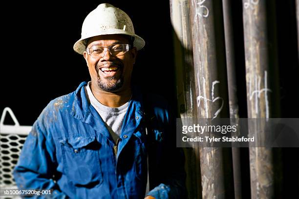 oil worker laughing, portrait - oil rig worker stock pictures, royalty-free photos & images