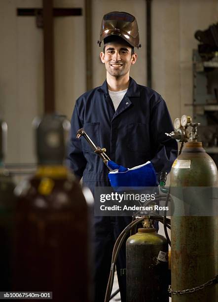 male welder smiling, portrait - welding mask stock pictures, royalty-free photos & images