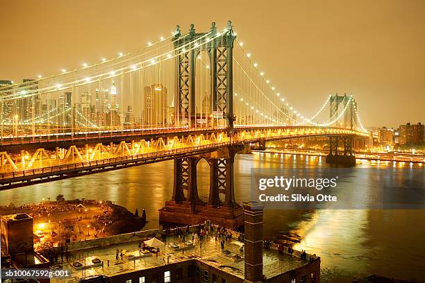 usa, new york, brooklyn bridge, brooklyn and manhattan at night on 4th of july - brooklyn bridge photos et images de collection