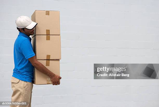 Stack Box Employee Male Employee Carrying Stack Of Boxes Inside Warehouse Side View High ...