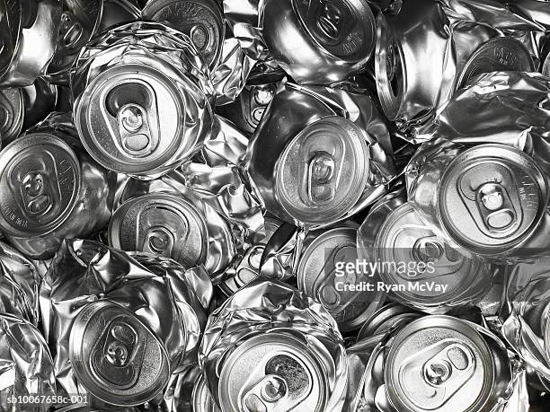 pile of crushed drink cans - lata fotografías e imágenes de stock
