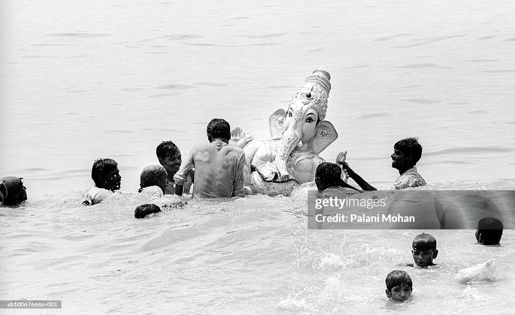 India, Mumbai, statue of Lord Ganesha is immersed in ocean by devotees