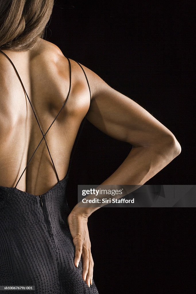 Athletic woman, rear view, studio shot