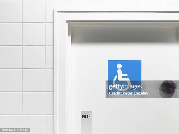 disabled sign on toilet door, close-up - public restroom door stock pictures, royalty-free photos & images