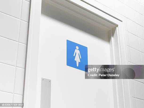 female sign on toilet door, low angle view, close-up - female likeness stock pictures, royalty-free photos & images