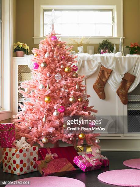 pink christmas tree in domestic room - kitsch stock pictures, royalty-free photos & images