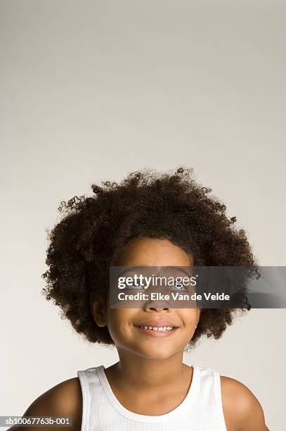 boy (4-5) with poofy hair looking up, studio shot - child portrait studio stock pictures, royalty-free photos & images