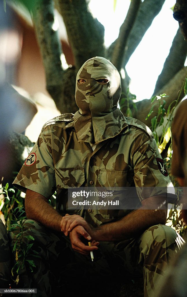 South Africa, Rustenburg, masked man from Afrikaner Resistance Movement smoking