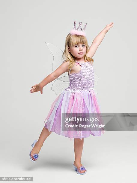 girl (2-3 years) wearing fairy princess costume dancing, portrait, studio shot - principessa foto e immagini stock