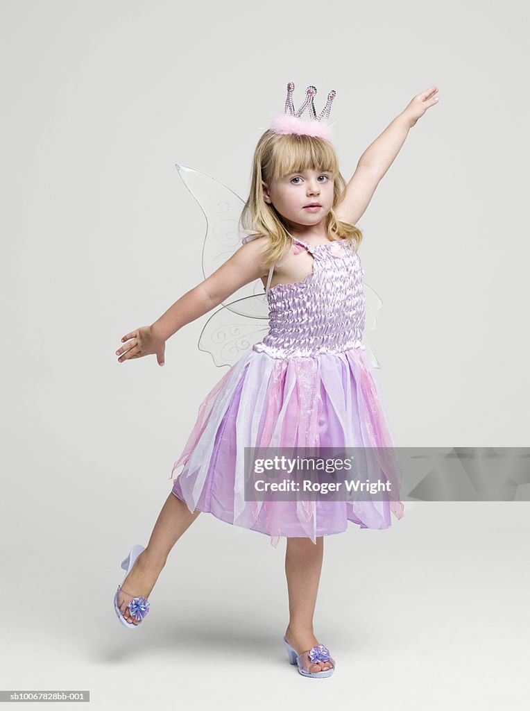 Girl (2-3 years) wearing fairy princess costume dancing, portrait, studio shot