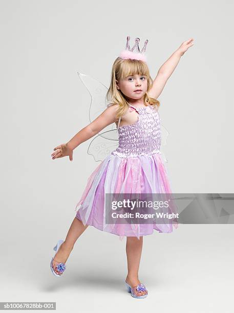 girl (2-3 years) wearing fairy princess costume dancing, portrait, studio shot - only girls stock pictures, royalty-free photos & images