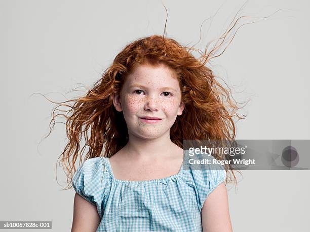 studio portrait of girl (8-9 years) with red hair - freckle girl foto e immagini stock