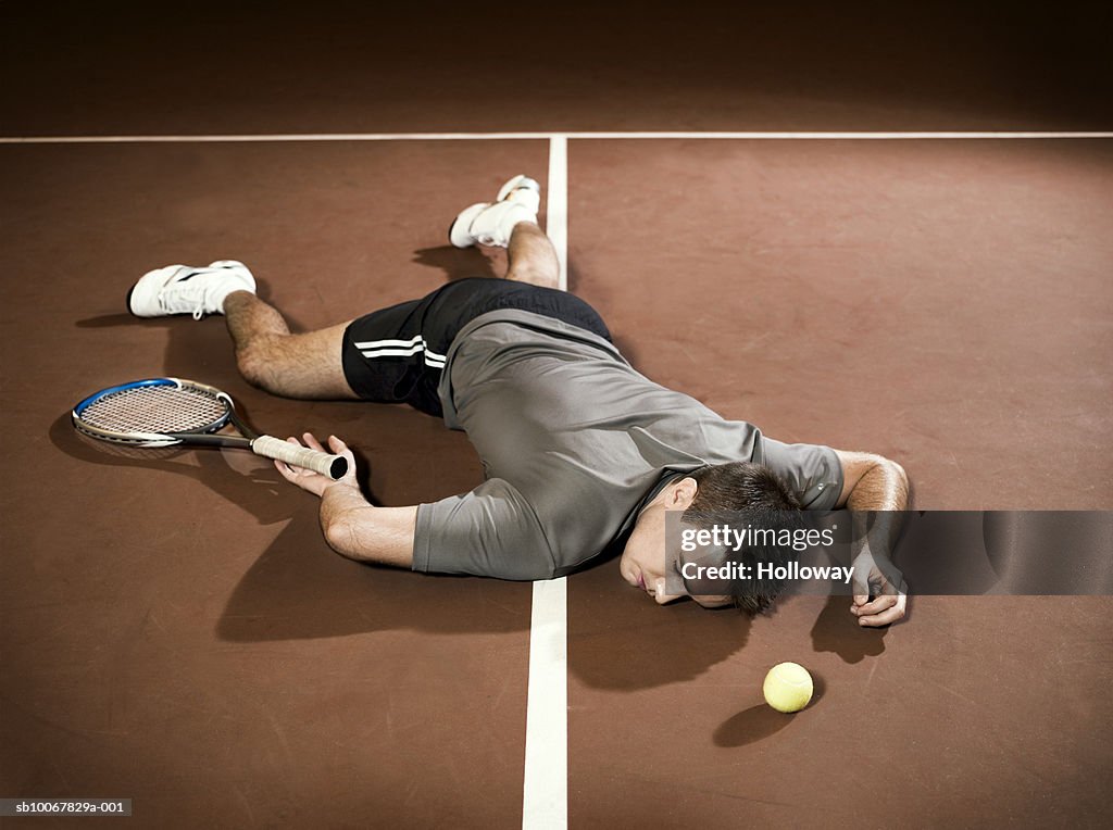Tennis player lying unconscious on court