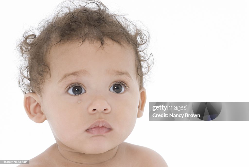 Baby boy (6-11 months) on white background