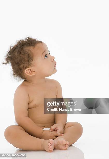 baby boy (6-11 months) sitting on white background - baby studio bildbanksfoton och bilder