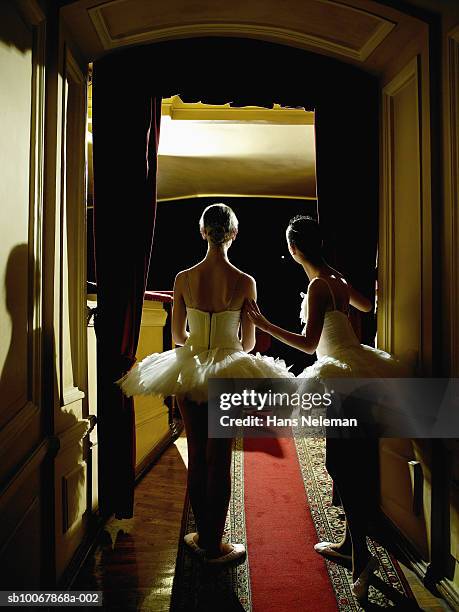 two teenage ballet dancers (14-15) waiting in wings, rear view - backstage view stock pictures, royalty-free photos & images