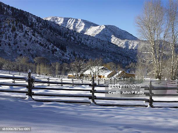 usa, colorado, new castle, east elk creek, snow covered fences and ranch buildings - new castle colorado stockfoto's en -beelden
