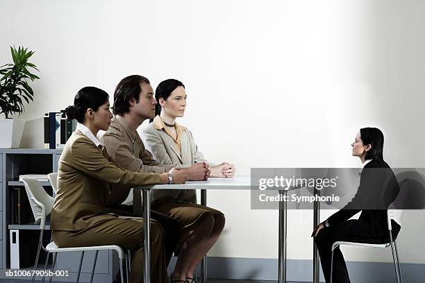 three giant business people interviewing small female colleague (digital composite) - interview funny stock pictures, royalty-free photos & images