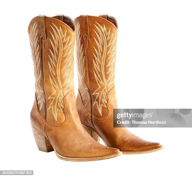 cowboy boots on white background - cowboy boots stock pictures, royalty-free photos & images