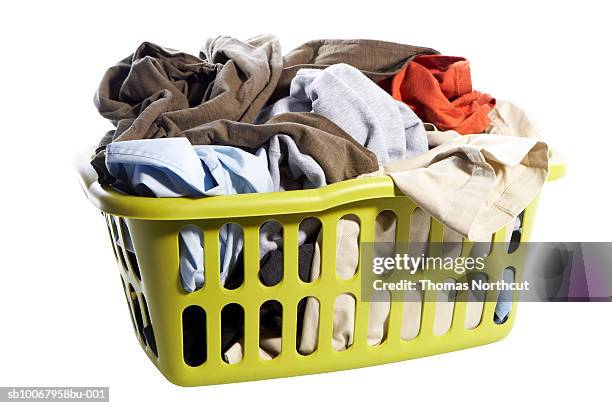 Laundry Basket With Clothes On White Background High-Res Stock Photo