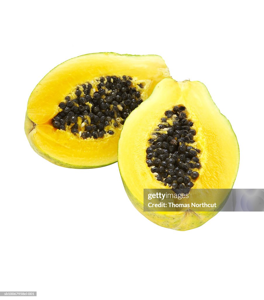 Papaya slices on white background