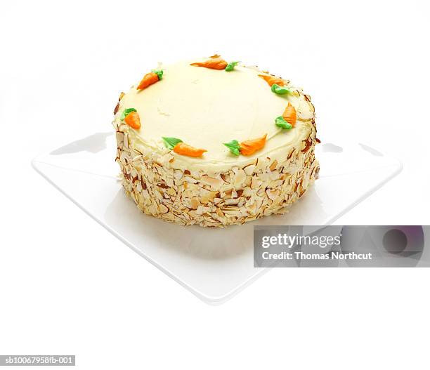 carrot cake on white background - carrot cake stock pictures, royalty-free photos & images