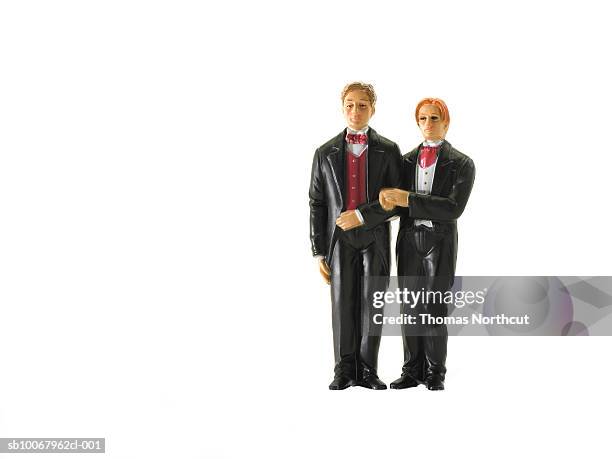 wedding figurines on white background - wedding cake figurine stock pictures, royalty-free photos & images