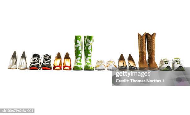 various shoes in a row, studio shot - calzature foto e immagini stock