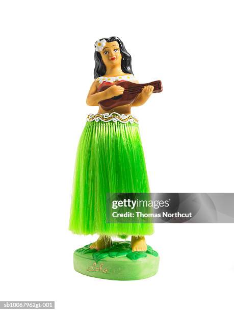 hula dancing doll on white background - hula dancing stock pictures, royalty-free photos & images