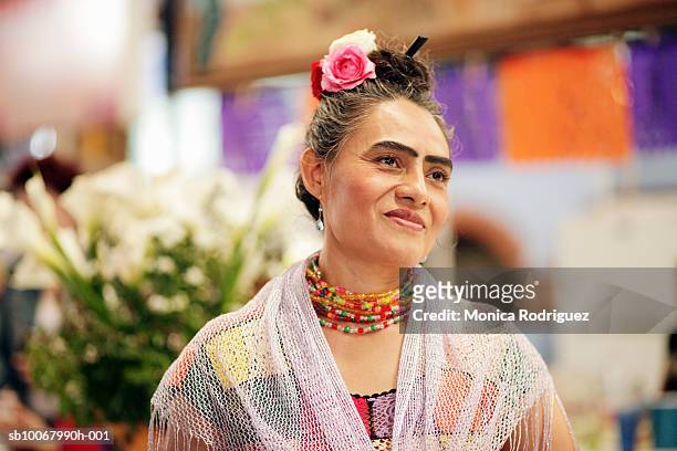 mexico, oaxaca, woman wearing shawl and rose in hair as frida khalo look-alike - look alike stock pictures, royalty-free photos & images