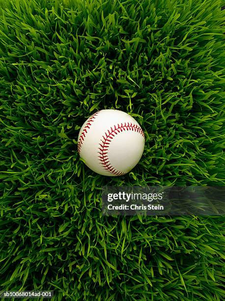 baseball in grass - baseball grass stock pictures, royalty-free photos & images