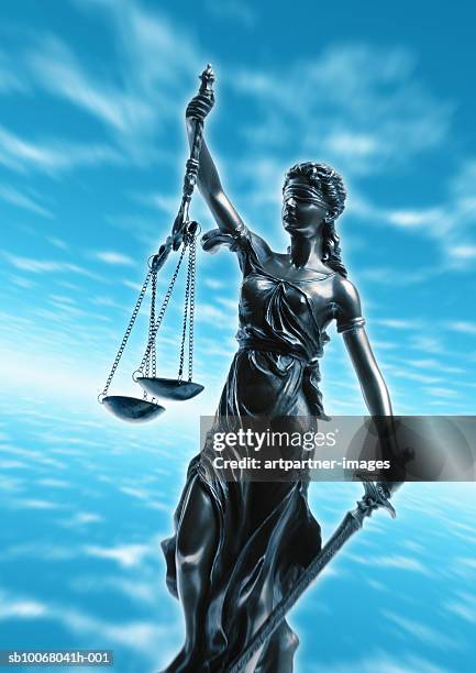 statue of woman, symbol of justice, against sky background - justitia-waage stock-fotos und bilder