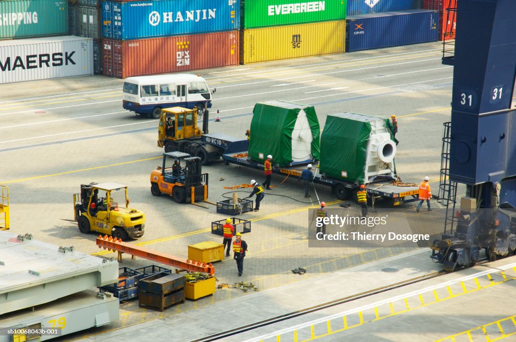 Dockers working at port, elevated view