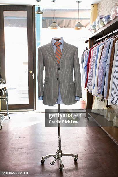 dressmaker's model with grey jacket in store - dress form stock pictures, royalty-free photos & images