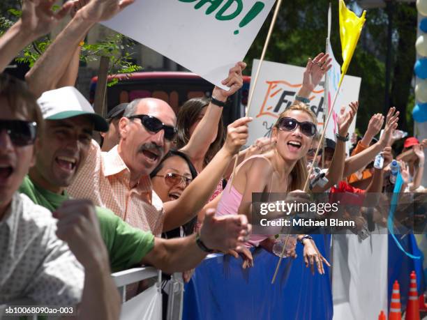 crowd watching marathon - parents applauding stock pictures, royalty-free photos & images