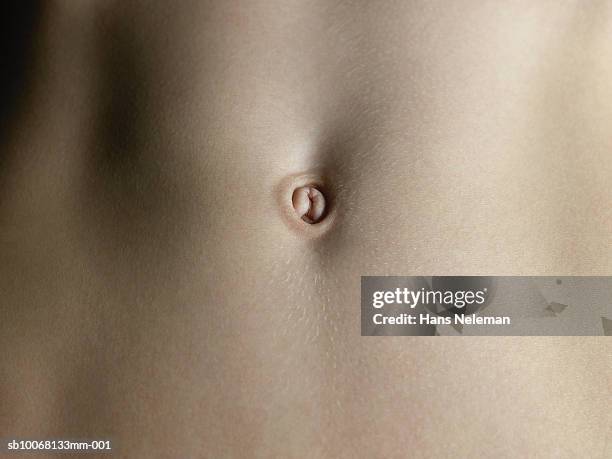 woman's stomach, mid section - bauchnabel stock-fotos und bilder