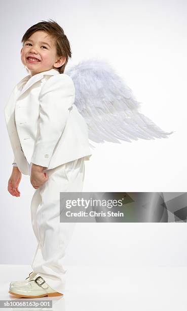 boy (2-3) wearing angel costume, studio shot - 天使 ストックフォトと画像