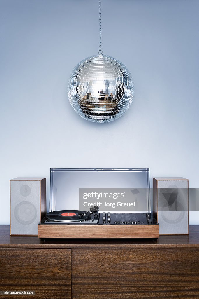 Disco ball hanging over 1970?s stereo system