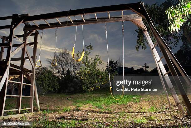 empty swings and gymnastic rings - abandoned playground stock pictures, royalty-free photos & images