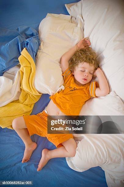 boy (2-3) sleeping on bed, overhead view - two boys in bed stock pictures, royalty-free photos & images