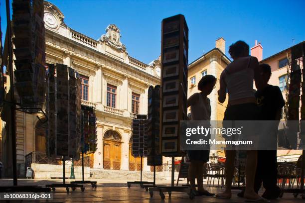 france, rhone-alpes, lyon, silhouettes of people on temple du change - lyon shopping stock pictures, royalty-free photos & images