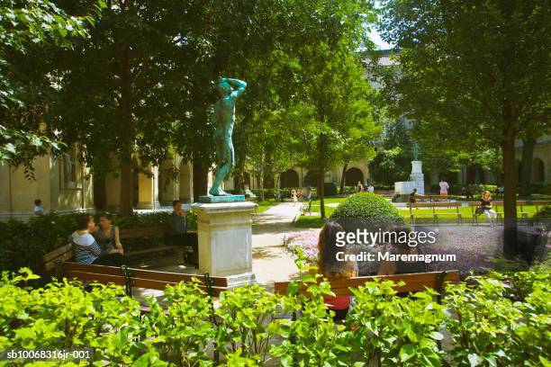 france, rhone-alpes, lyon, people relaxing in garden at museum of fine arts - lyon photos et images de collection